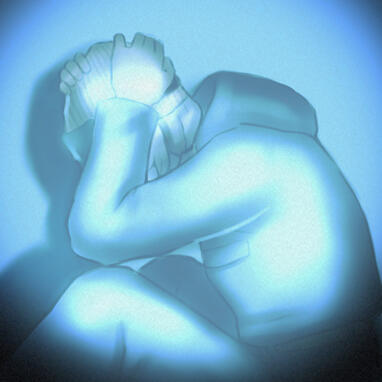 Rayleigh Collins faced away from the camera, her below shoulder length hair is seen worn down.